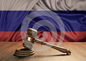 Wooden judge`s gavel Symbol of law and justice with the flag of Russia. Russian judicial system