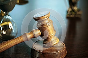 Wooden judge`s gavel. Themis figurine The criminal law.