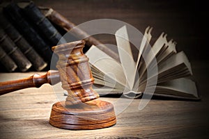 Wooden Judges Gavel And Old Law Books On Wooden Background