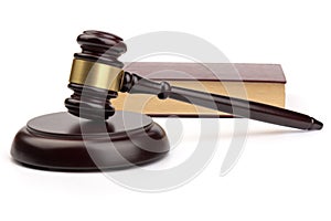 Wooden judges gavel on white background in close up. Space for text