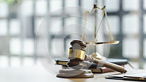 Wooden judges gavel on wooden table, close up