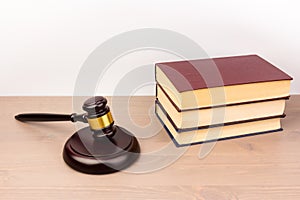 Wooden judges gavel on wooden table, close up. Space for text