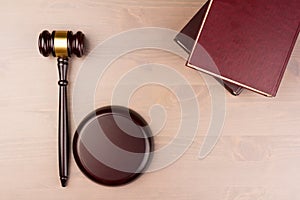 Wooden judges gavel on wooden table, close up. Space for text