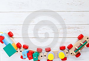 Wooden kids toys on white background. Educational toys blocks, numbers, letters, train. Toys for kindergarten, preschool