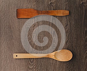 Wooden kitchen accessories on wood background