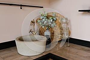 Wooden kitchen with a beautiful decor and a stone sink and a vintage mixer