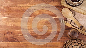 Wooden kitchen equipment on a dark wooden background. View from above photo