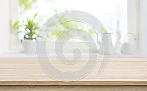 Wooden kitchen table with background of window for product display
