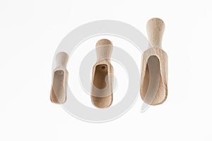 Wooden kitchen tools on bright background