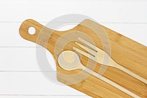 Wooden kitchen utensils on a cutting board