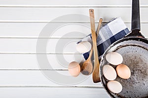Wooden kitchen utensils on the table. Recipe book wooden spoon in a retro style on wooden table