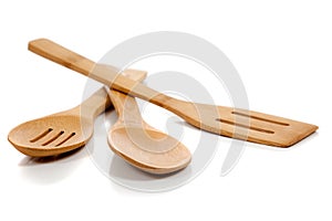 Wooden kitchen utensils on white