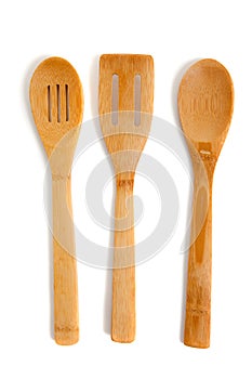Wooden kitchen utensils on a white background