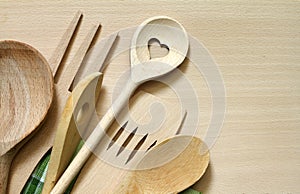 Wooden kitchenware on cutting board
