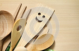 Wooden kitchenware on cutting board