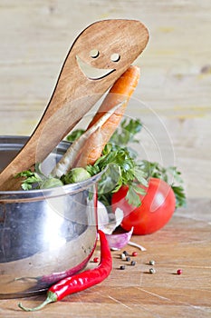 Wooden kitchenware on cutting board