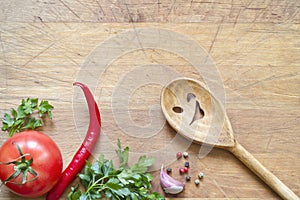 Wooden kitchenware on cutting board