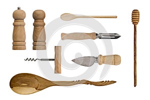 Wooden kitchenware isolated on white background. Spoons, corkscrew, knives, salt shaker and pepper