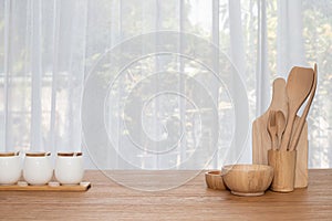Wooden kitchenware on kitchen table