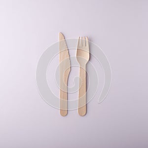 wooden knife and fork disposable eco-friendly tableware on a white background