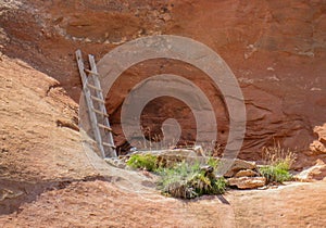 Wooden Ladder against Sandstone Cliff