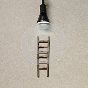 Wooden ladder with lamp light. Development, challenge, success concept