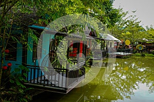 Wooden lakeside villas with balconies looking over lake