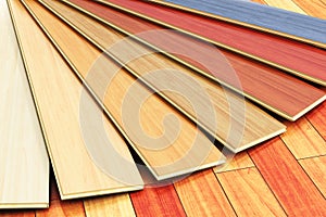 Wooden laminated construction planks assortment on parquet floor
