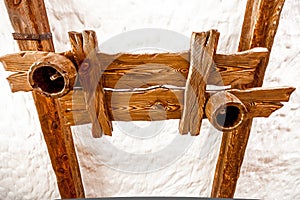 Wooden lamp hanging on white ceiling