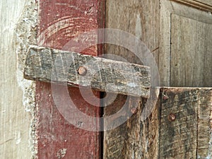 a wooden latch nailed to the door jamb to lock the door