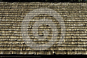 Wooden lath shingles at the old traditional village house roof, Latvia.