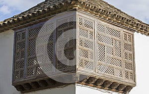 Wooden lattice work corner balcony, Cordoba, Spain