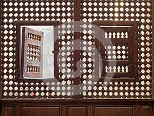 Wooden latticed window Mashrabiya with two small swinging sashes photo