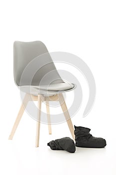 Wooden Leg Chair and Black Boots on White