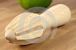 Wooden lemon or citrus reamer photo