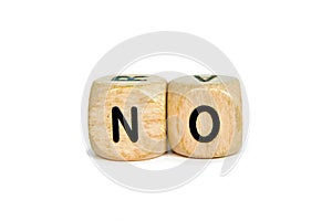 Wooden letter dice forming the word `No` isolated on white background