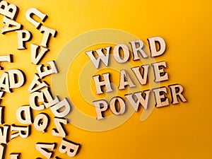 Wooden letter toy arranged the word WORD HAVE POWER