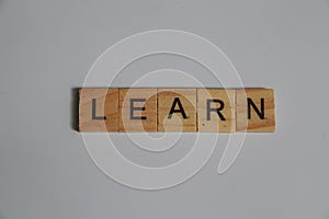 Wooden letters arranged into the word learn