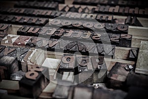 Wooden letters blocks from old letterpress alphabet used for typesetting photo