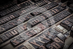 Wooden letters blocks from old letterpress alphabet used for typesetting