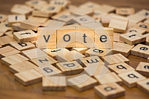 Wooden letters composing the words `vote`