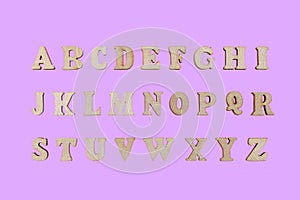 wooden letters of the English alphabet on a pink background