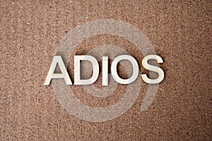 Wooden letters forming the words Adios in Spanish photo
