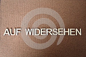 Wooden letters forming the words Auf Widersehen in German photo
