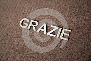 Wooden letters forming the words Grazie in Italian