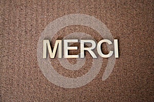 Wooden letters forming the words Merci in French