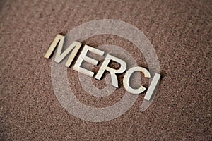 Wooden letters forming the words Merci in French