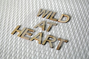 Wooden letters forming the words Wild At Heart for everyone