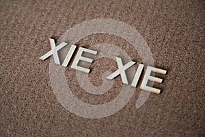 Wooden letters forming the words Xie Xie in Mandarin