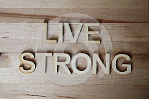 Wooden letters making the word Live Strong